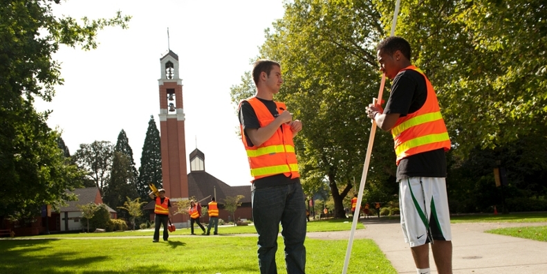 Two students surveying campus landmarks.