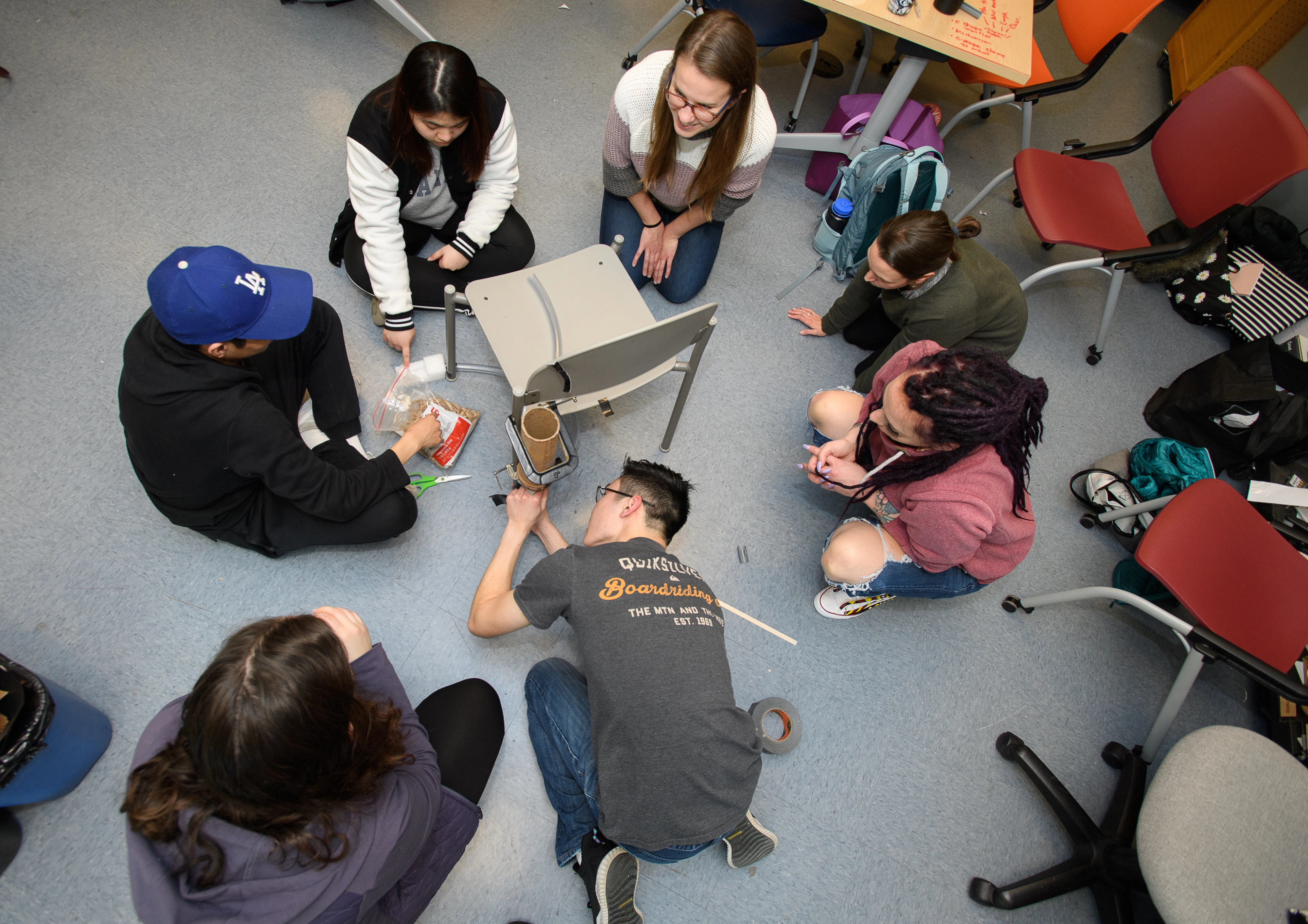 Students work together to prototype a feature of adaptive seating. 