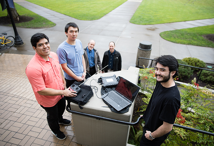 photo of students and engineering professors outside Shiley Hall