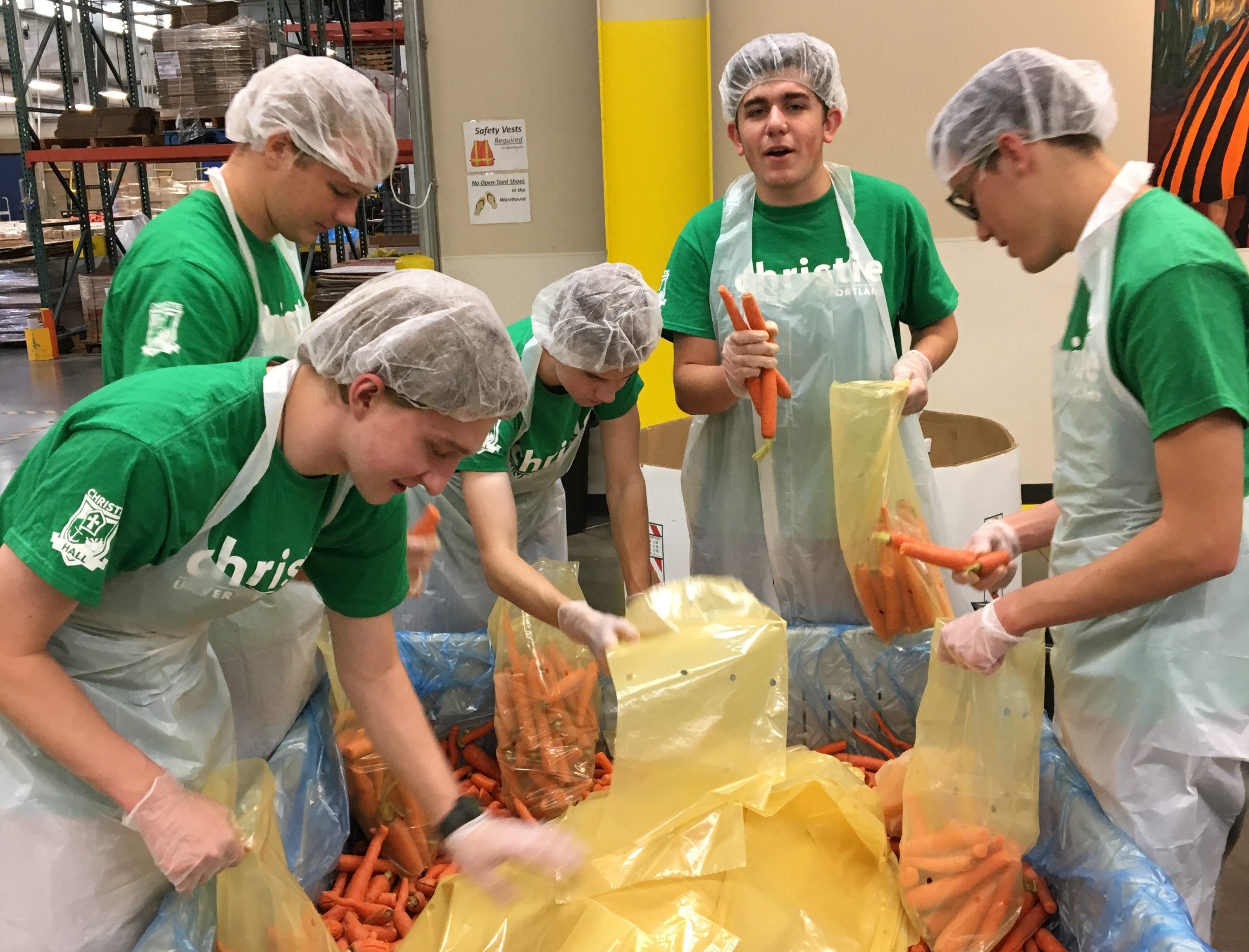 Christie Hall Men sorting carrots for Oregon Food Bank