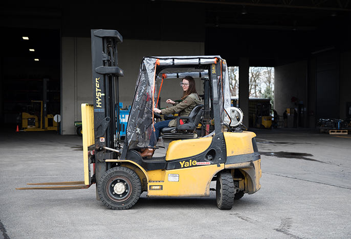 female student on construction equipment